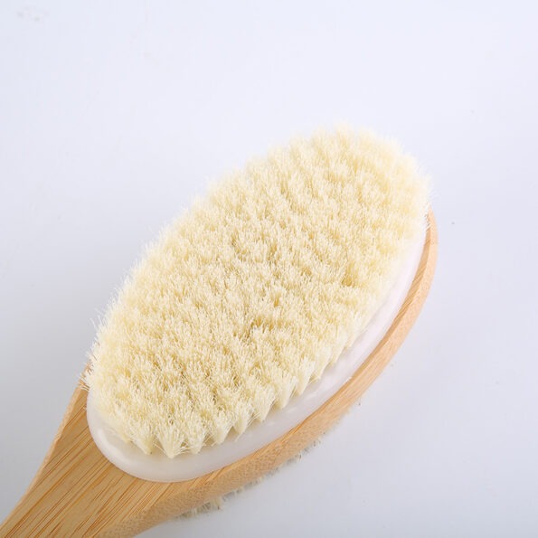 Dry and wet shower brush with ergonomic grip.